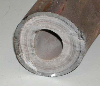 Hardness in water: Limescale buildup inside a water pipe